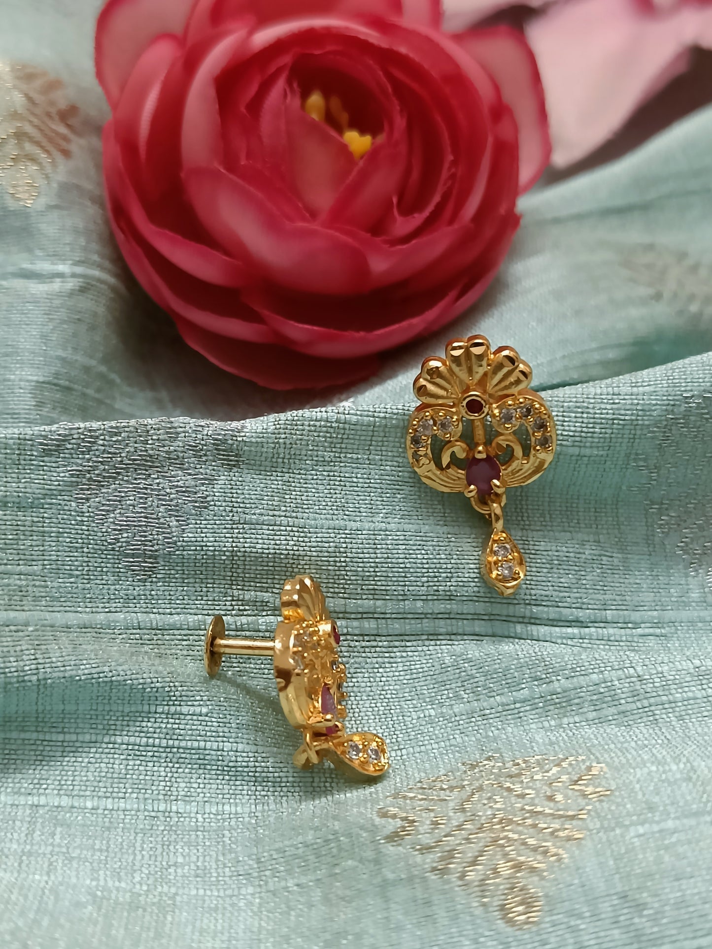Gold plated studs adorned with drops with maroon and AD stones