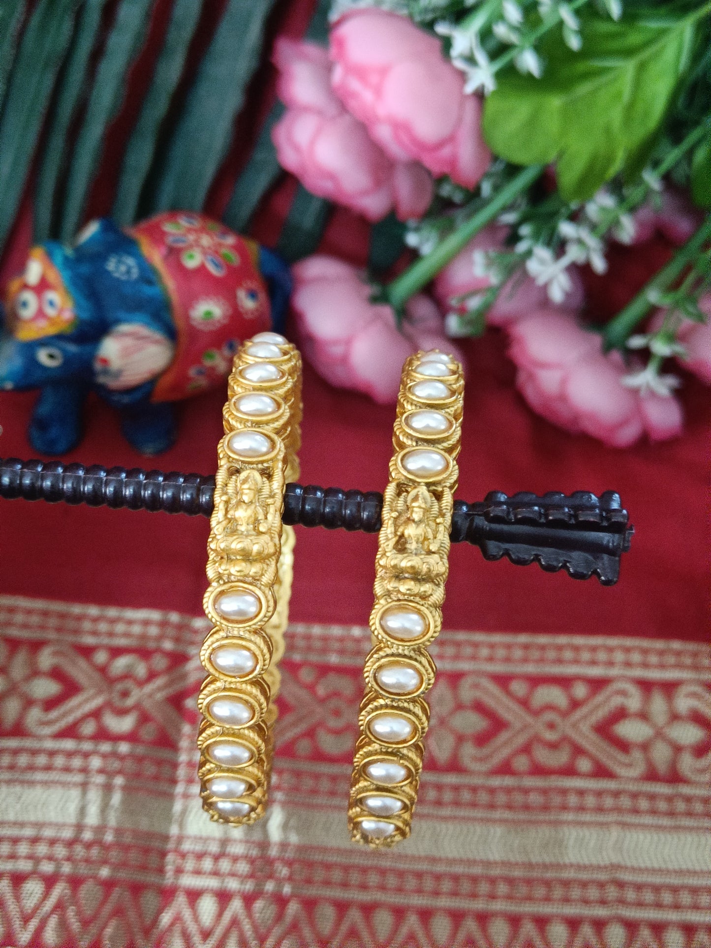 Matt finish Lakshmi and oval shaped pearl design bangle set