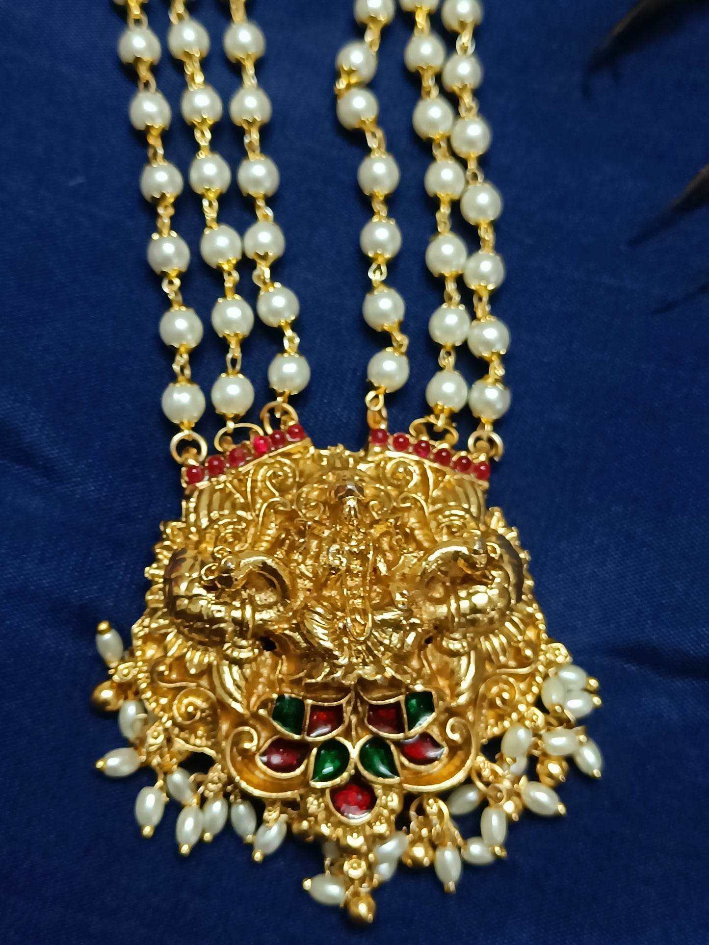Lakshmi pendant set featuring charming dancing dolls, peacock and elephant motifs (Copy)